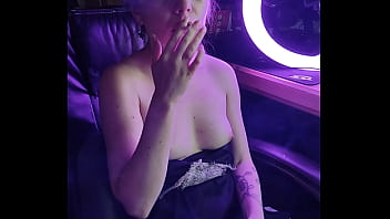 beautiful leather domanatrix smoking cigarettes